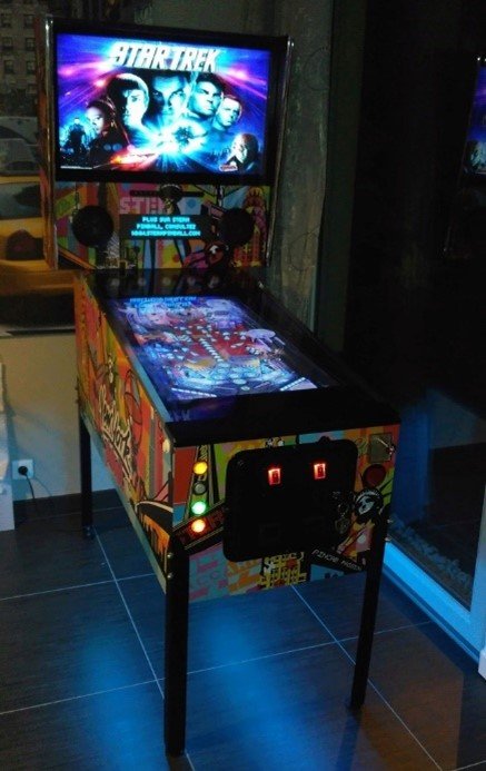 A pinball machine is a physical game, which consists in sending a metal ball on elements riveted on a wooden board (targets, ramps...)